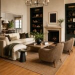 A modern living room with white furniture, a fireplace, and honey oak wood floors.