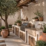 Outdoor kitchen with stone counters, built-in grill, and wooden cabinets under a pergola.